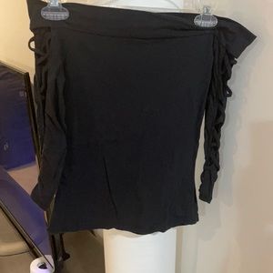 Really cute black off the shoulder top with holes along the sleeves.